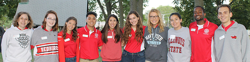 Three students smile for a photo at an Honors Program event.